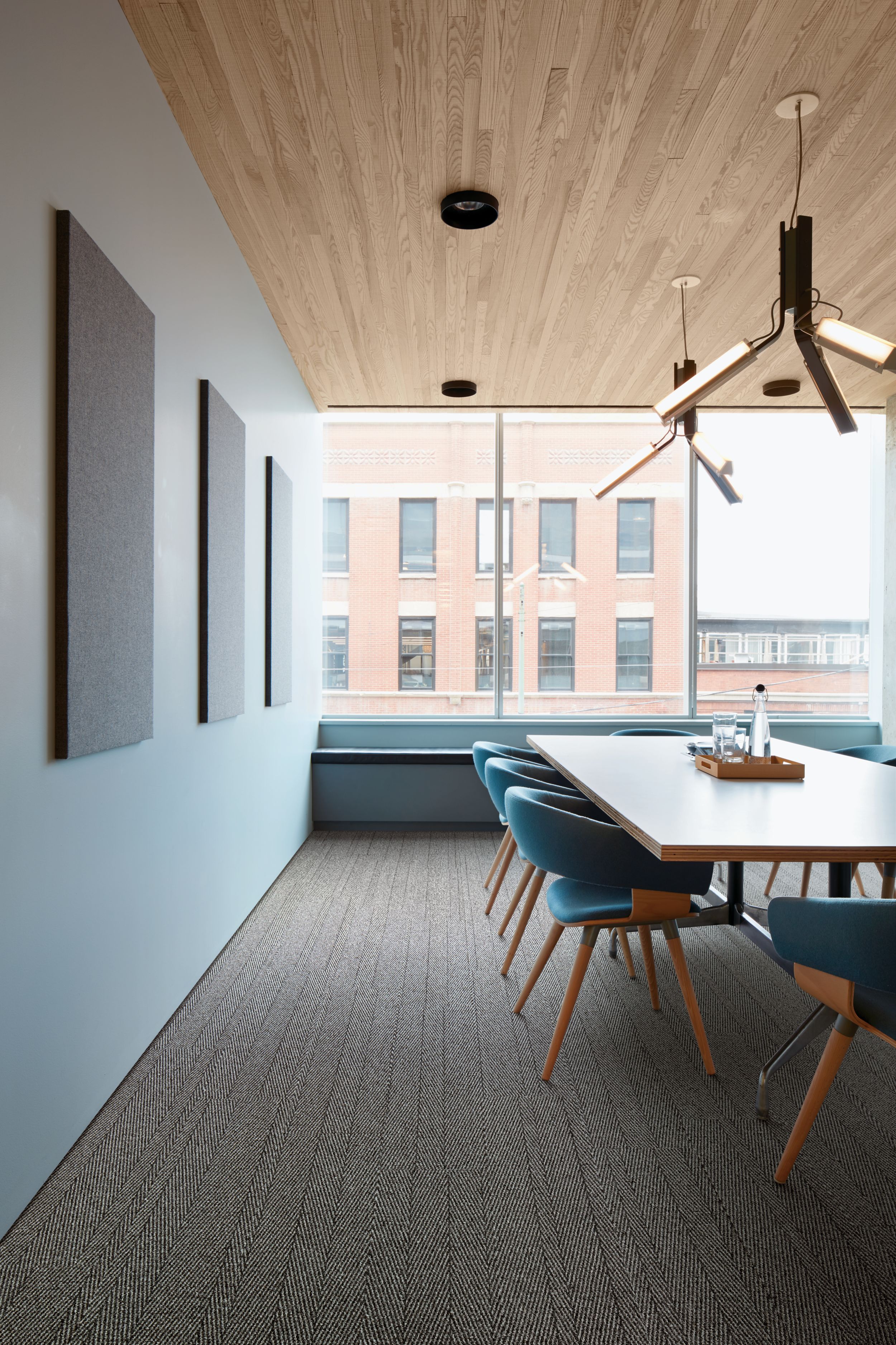 Interface Stitch in Time plank carpet tile in meeting space with wood paneling image number 2